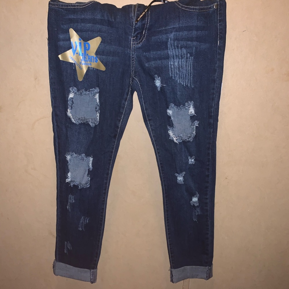Never worn dark washed distressed jeans
